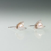 Load image into Gallery viewer, Side View of the Mini scallop shell stud earrings cast in silver with freshwater pearls inside by Hali MacLaren of HKM Jewelry
