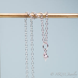 underside of mini conch seashell necklace cast in silver by hali maclaren of hkm jewelry