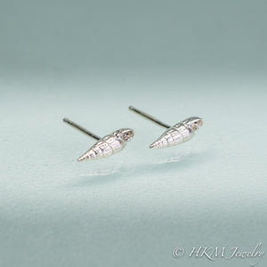 mini auger snail seashell studs with posts close up side view in polished sterling silver by hkm jewelry