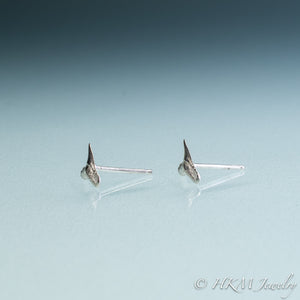 side view of mini lemon shark teeth stud earrings cast in silver by hali maclaren of hkm jewelry