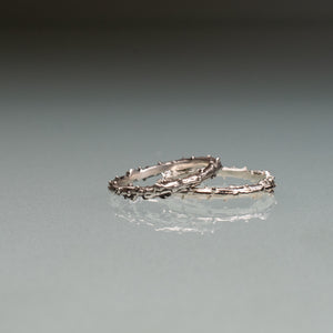 cast pine needle bough twig ring band comparison in polished and oxidized by hkm jewelry