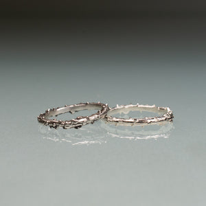 cast pine needle bough twig ring band comparison in polished and oxidized by hkm jewelry