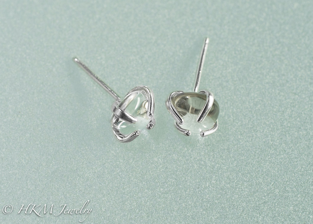 close up side view of small size prong set tumble polished cape may diamond stud earrings in sterling by hkm jewelry