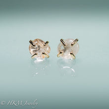 Load image into Gallery viewer, close up front view of medium size prong set tumble polished cape may diamond stud earrings in 14k yellow gold by hkm jewelry

