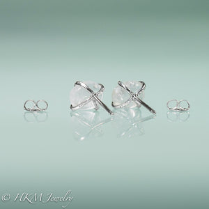 back view of medium size prong set tumble polished cape may diamond stud earrings in sterling with ear nuts by hkm jewelry