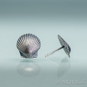 front and side view of small scallop shell studs in oxidized sterling silver by hkm jewelry with sterling posts
