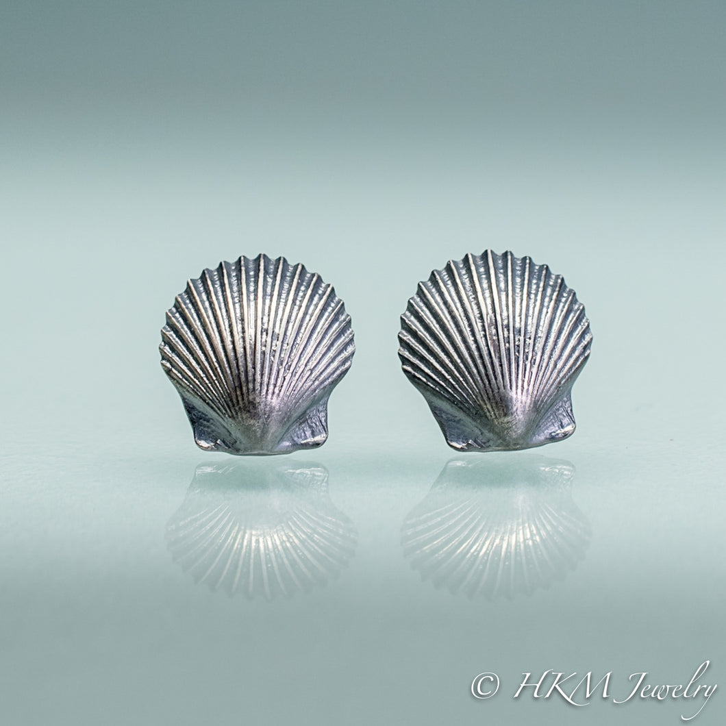front view of small scallop shell studs in oxidized sterling silver by hkm jewelry