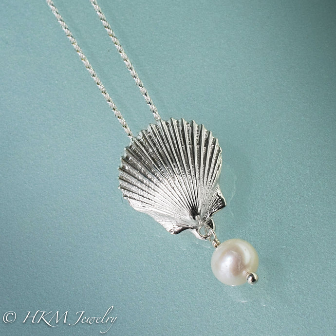the scallop pearl necklace in polished finish with white freshwater pearl drop by hkm jewelry