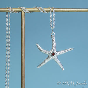 silver starfish necklace with garnet gemstone January birthstone by HKM Jewelry