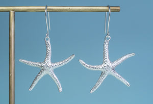 The Starfish Dangle Earrings cast in recycled silver