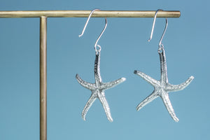 backview of silver starfish dangles by hkm jewelry