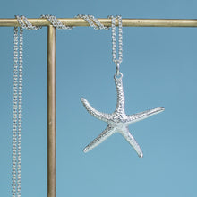 Load image into Gallery viewer, close up view of starfish necklace molded and cast in recycled silver
