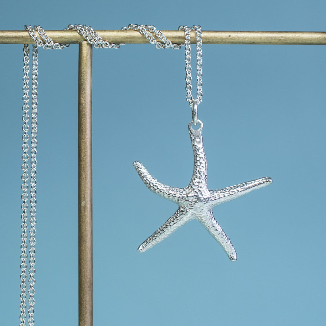 close up view of starfish necklace molded and cast in recycled silver