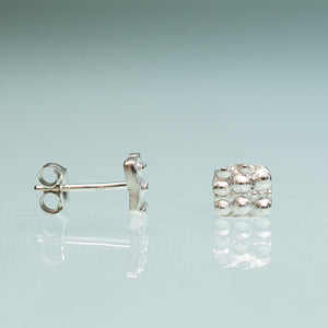 mini urchin square studs close up front and side view in sterling silver by hkm jewelry