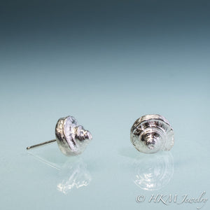 Side and Front view of the Channeled Whelk Top Studs in sterling silver by Hali MacLaren of HKM Jewelry on blue ombre background.