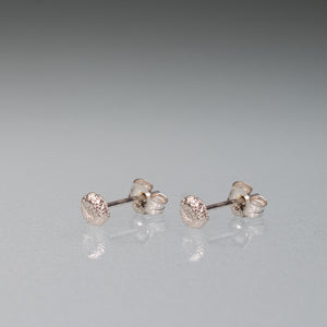 side view of the make a wish earrings, cast silver dandelion seed pad studs by hkm jewelry